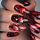 Nails with red, black, and white abstract design on a neutral background, Obroi