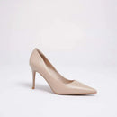 A single light beige pointed-toe high heel pump photographed on a clean white studio background, Obroi