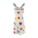 White dress with colorful floral pattern on a white background, Obroi