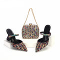 Pair of embellished high-heeled shoes with a matching handbag on a white background, Obroi