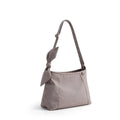 Gray handbag with a bow detail on a white background, featuring the Obroi brand.