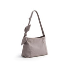 Gray handbag with a bow detail on a white background, featuring the Obroi brand.