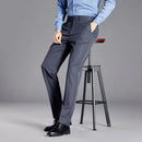Person wearing gray pants and a blue shirt on a gray background with 'Obroi' branding.