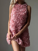 Pink floral dress worn by a model on a gray background, Obroi