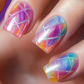 Nails with colorful geometric design on a blurred background, Obroi