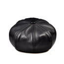 Black leather beret on a white background, Obroi