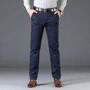 Person wearing navy blue pants with a gray background, Obroi