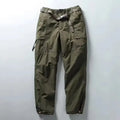 Green cargo pants on a light gray background, Obroi