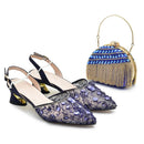 Navy blue embellished shoes with a matching handbag on a white background, Obroi