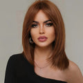 Woman with styled hair and makeup, wearing a black top, with 'Obroi' brand name, Obroi
