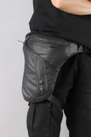 Person wearing a black waist bag on a plain background, Obroi