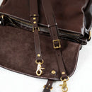 Brown leather bag with gold hardware on a white background, Obroi