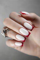 Close-up of a hand with red and white nail design, Obroi