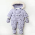 Purple baby snowsuit with fur hood on a light beige background, Obroi