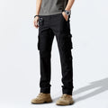 Person wearing black cargo pants on a white background, Obroi