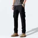 Person wearing black cargo pants on a white background, Obroi