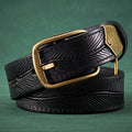 Black leather belt with a gold buckle on a green background, Obroi