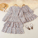 Children's dress with blue polka dot pattern on a light background, accompanied by shoes and a hat, Obroi