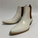 Pair of white ankle boots with brown soles on a light gray background, Obroi