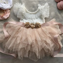 Children's dress with ruffled top and tulle skirt on a neutral background, Obroi