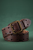 Brown leather belt with brass buckle on a green background, Obroi