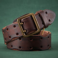 Brown leather belt with brass buckle on a green background, Obroi