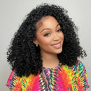 Woman with curly hair wearing a colorful tie-dye shirt indoors, Obroi