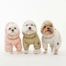Three dogs wearing colorful puffer jackets on a white background, Obroi