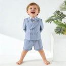 Child wearing a blue checkered suit with a bow tie on a white background, Obroi