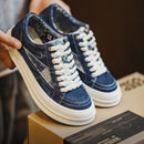 Blue denim sneakers with white laces on a box, Obroi