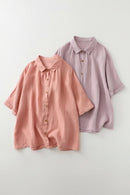 Two button-up shirts, one pink and one purple, on a light gray background, Obroi