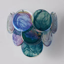 Colorful glass art piece on a plain background, Obroi