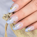 Nail art with gold stars and moons on light blue nail polish, Obroi