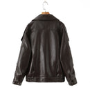 Obroi Brown leather jacket on a hanger against a white background