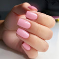 Hand with pink nail polish on a neutral background, Obroi