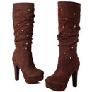 Brown platform high-heeled boots with decorative studs on a white background, Obroi