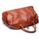 Brown leather bag on a white background, Obroi