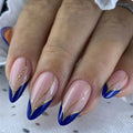 Nails with blue and gold design on a white background ,Obroi