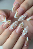 Nails with floral and gold designs on a neutral background, Obroi