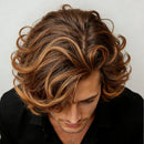 Man with styled hair looking downwards against a neutral background, Obroi