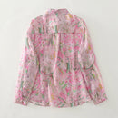 Pink floral patterned shirt on a light gray background, Obroi
