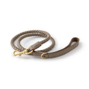 Brown braided dog leash with gold clasp on a white background, Obroi
