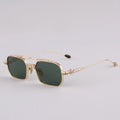 Gold-framed sunglasses with green lenses on a light gray background, Obroi