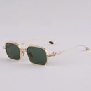 Gold-framed sunglasses with green lenses on a light gray background, Obroi