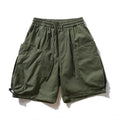 Green shorts with drawstring on a white background, featuring the brand 'Obroi'.