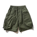 Green shorts with drawstring on a white background, featuring the brand 'Obroi'.