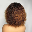 Curly wig with brown and black gradient on a white background, featuring the ' Obroi' brand.