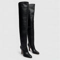 Black knee-high boots on a light gray background, Obroi