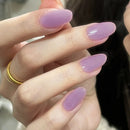 Hand with lavender nail polish on a blurred background, Obroi