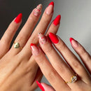 Close-up of hands with red and pink nail polish and gold rings, Obroi